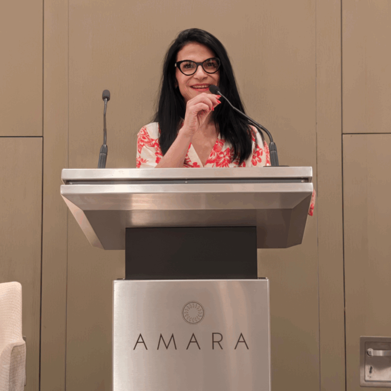 Xenia Neophytou at the podium delivering her address at the Wealth & Relocation Forum 2025